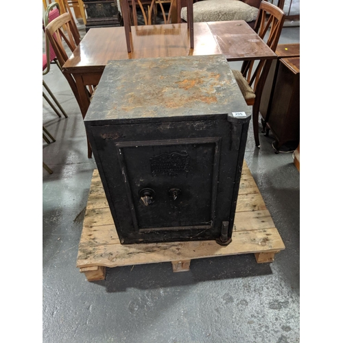 206 - A C.Price and Co antique safe with key