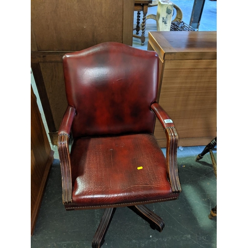 208 - A leather office chair