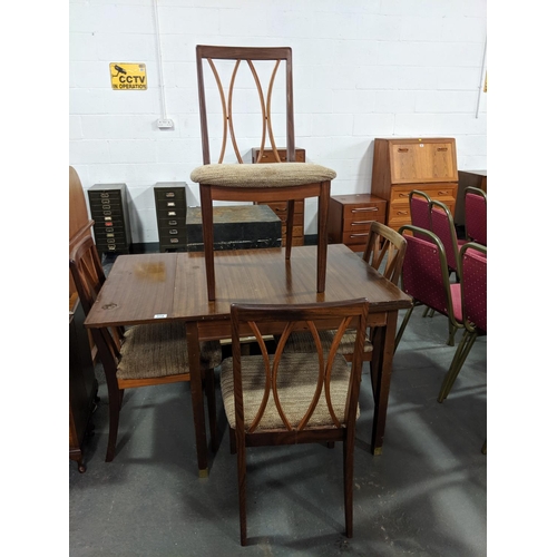 214 - A G Plan draw leaf dining table and four chairs