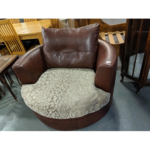 216 - A leather and uphosltered swivel chair