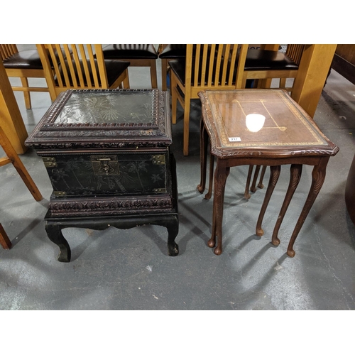 217 - Oriental chest on stand and a glass topped nest of tables