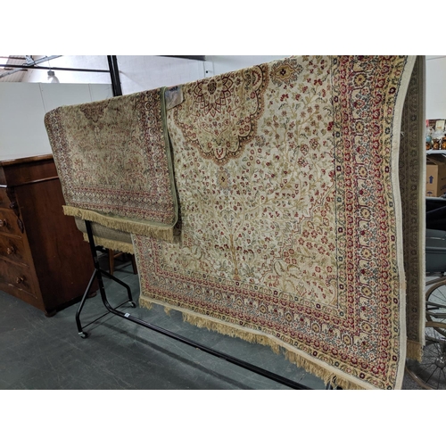 219 - Two Kashan silk rugs