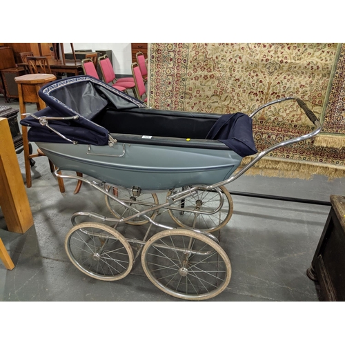 223 - A vintage silver cross pram