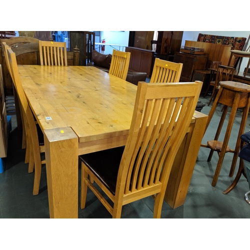 224 - A large dining table and six chairs