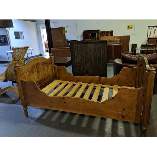 225 - A French, pine sleigh bed