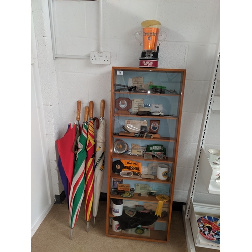 74 - A display case containing vintage car rally related items, ephmera, umbrellas to include car related... 