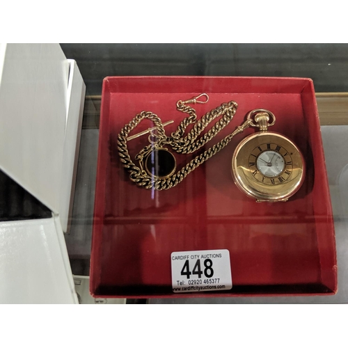 448 - A gold and gold plated pocket watch and fob chain and fob