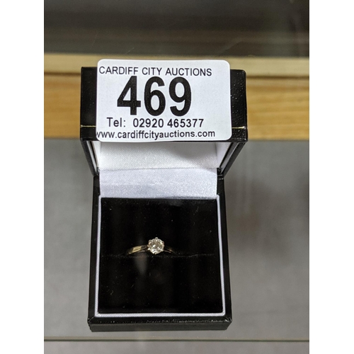 469 - An 18k gold engagement ring with single diamond