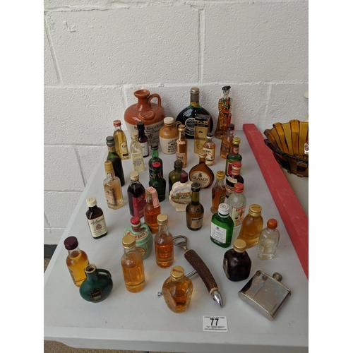 77 - A collection of miniature bottles of alcohol etc.