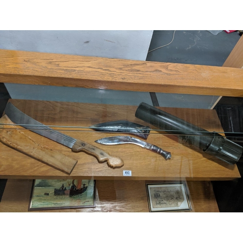 493 - A Kukri, a machette and a plastic shell case holder