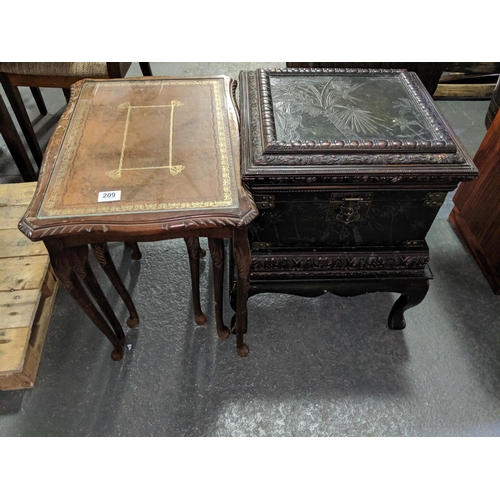 209 - An oriental chest on stand and a glass topped nest of tables