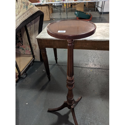 220 - A mahogany torchiere/ plant stand