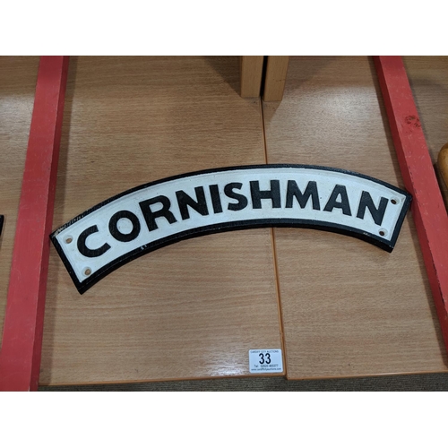 33 - A cast iron Cornishman plaque