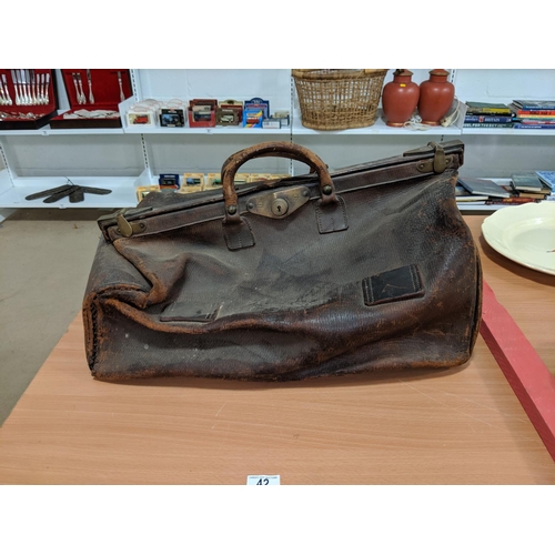 42 - A leather Gladstone bag