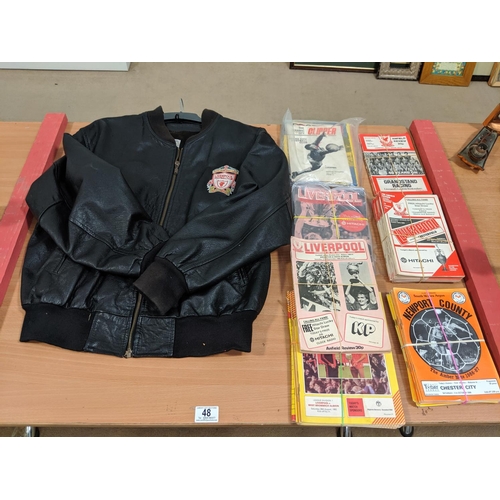 48 - A selection of vintage Liverpool football programmes and a vintage leather Liverpool F.C jacket