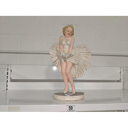 59 - A cast iron Marilyn Monroe doorstop