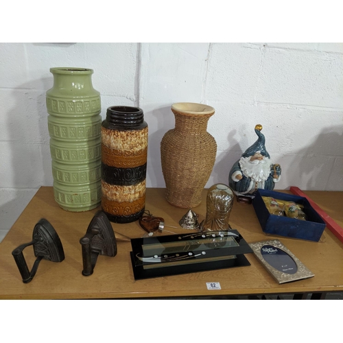 82 - German pottery vases, irons etc.