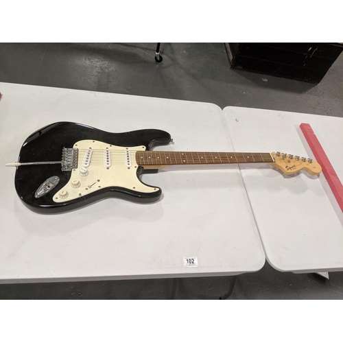 102 - A Fender Squire strat 'Blackie' electric guitar