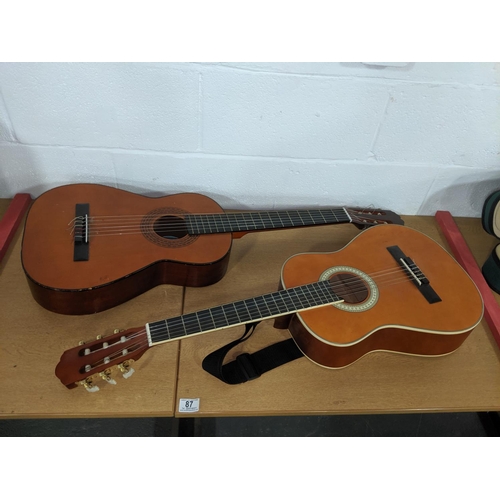 87 - Two acoustic guitars- one 3/4 size