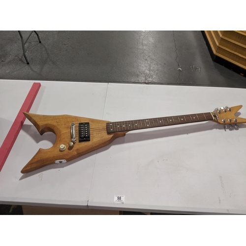 98 - A wooden electric guitar