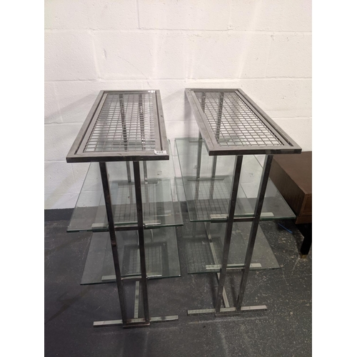 202 - A pair of chrome and glass shelving units