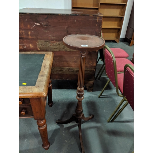 215 - A mahogany torchiere/ plant stand