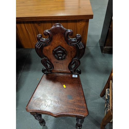 220 - An early mahogany hall chair