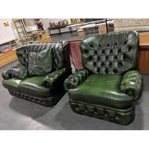 221 - A button backed, green leather, two seater settee and matching armchair