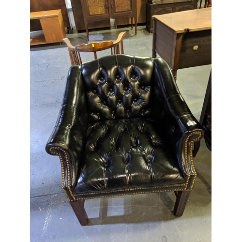 229 - A black leather,chesterfield office chair