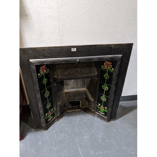 233 - A cast iron and tiled fire surround