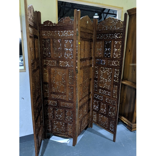 235 - A carved,wooden four fold screen