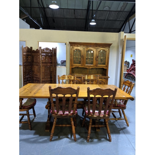 236 - A large pine dining table and six chairs and a matching dresser