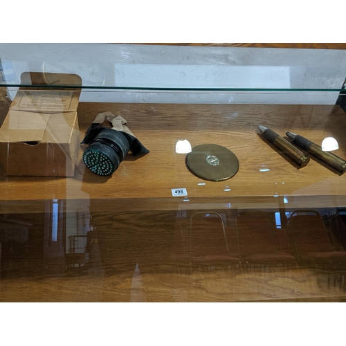 498 - Two 30mm bullets, a gas mask and a tank regiment brass plaque