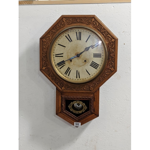 500 - An oak cased wall clock