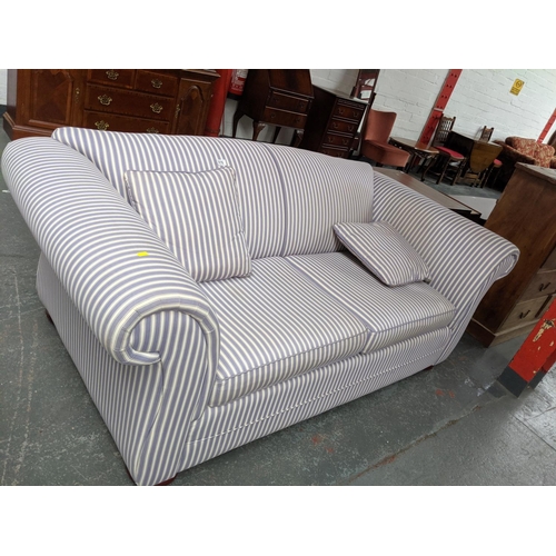 876 - A two seater sofa