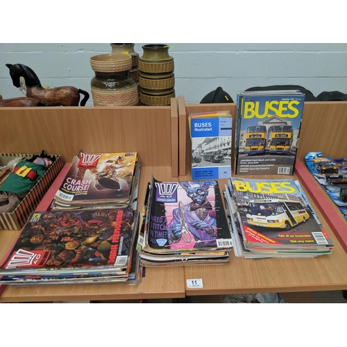 11 - A quantity of 2000AD comics and vintage ' Buses Illustrated'