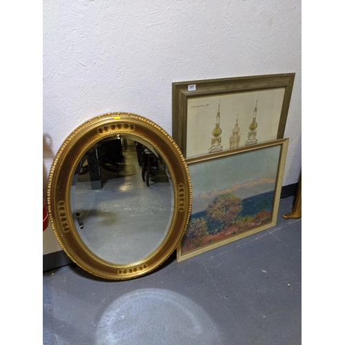 241 - An oval mirror and two prints