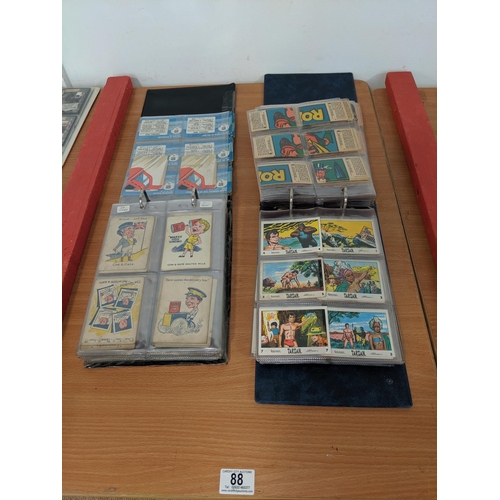 88 - Two albums containing vintage collectors cards including Cow & Gate, Batman, Tarzan etc.