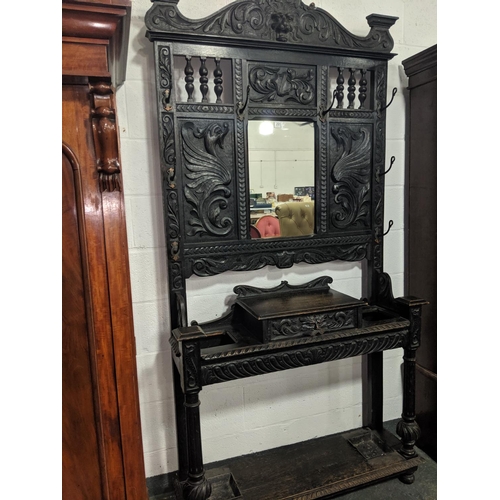 201 - A heavily carved oak hallstand