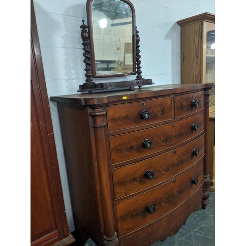 203 - Victorian bow fronted mahogany chest of drawers and a toilet mirror