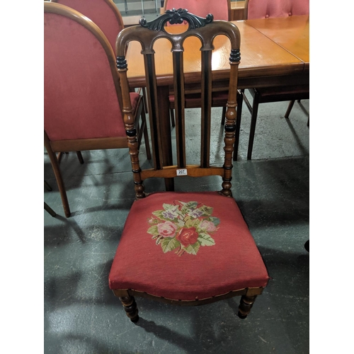 207 - A 19th century birch Biedermeier style nursing chair with ebonies decoration
