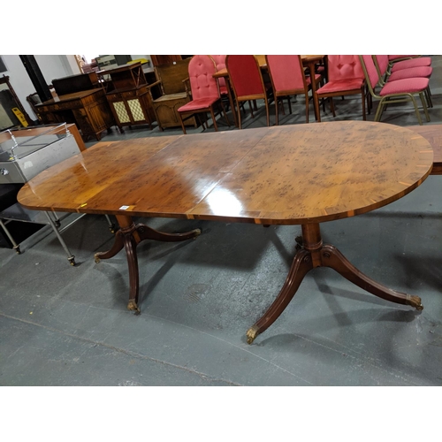 225 - A birds eye maple twin pedestal dining table