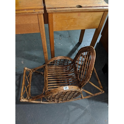 229 - An Edwardian bamboo child's rocking chair in original condition