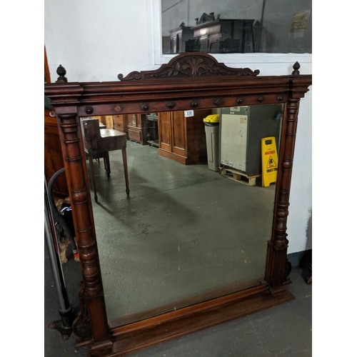 238 - A large mahogany over mantle mirror