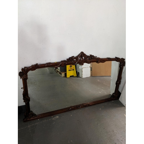 239 - A carved mahogany overmantle mirror