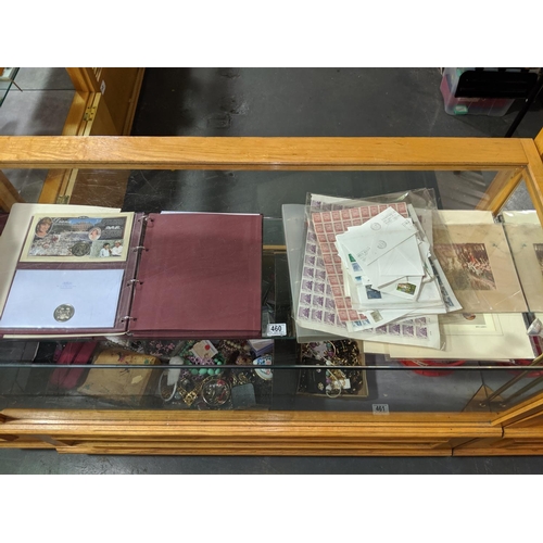 460 - Sheets of stamps, stamped envelopes, first day cover albums (empty) and a royal family coin collecti... 