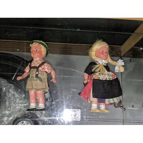 479 - Two clockwork dolls with key