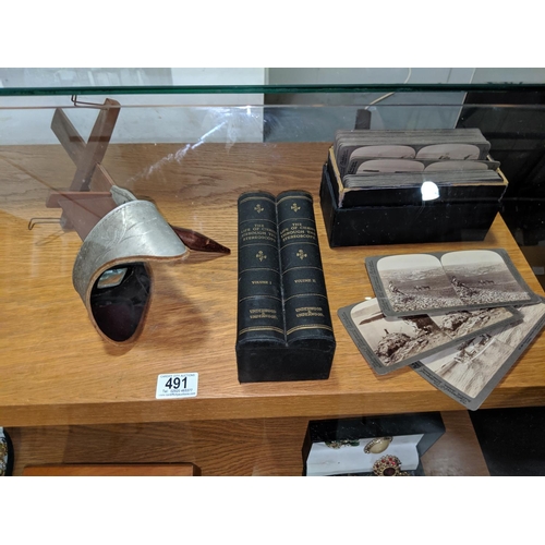 491 - A Victorian stereoscope viewer and boxed slides