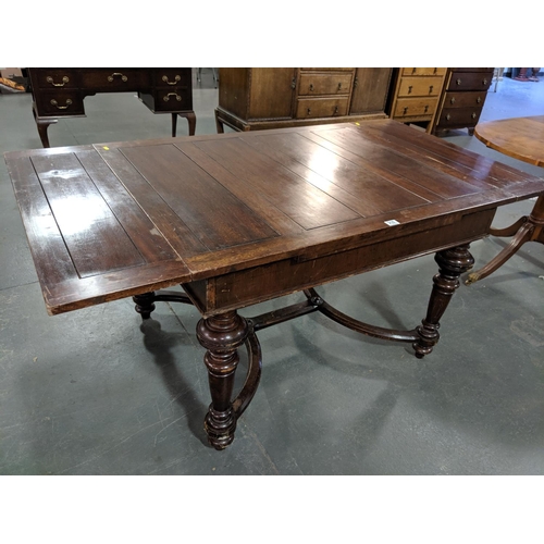 216 - A draw leaf mahogany dining table