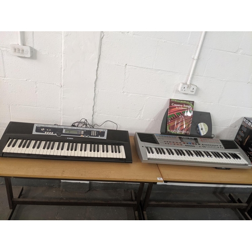 61 - A Yamaha YPT-210 keyboard and a Roland EM-25 keyboard